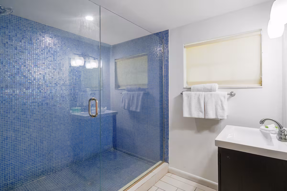 Private bathroom with separate bathtub and shower